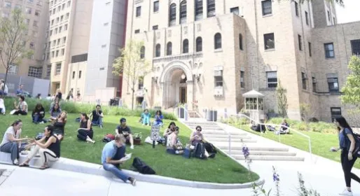 Students sitting outside on campus
